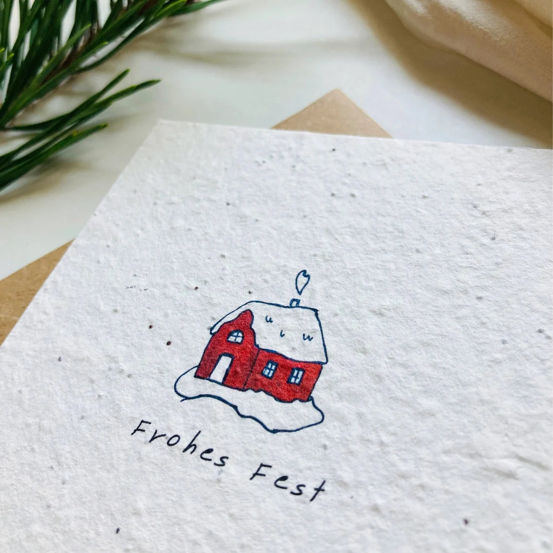 Einpflanzbare Karte aus handgemachtem Saatpapier | Frohes Fest Häuschen
