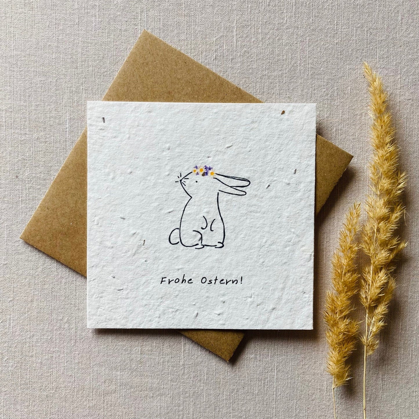 Einpflanzbare Karte aus handgemachtem Saatpapier | Frohe Ostern Hase mit Blumenkranz