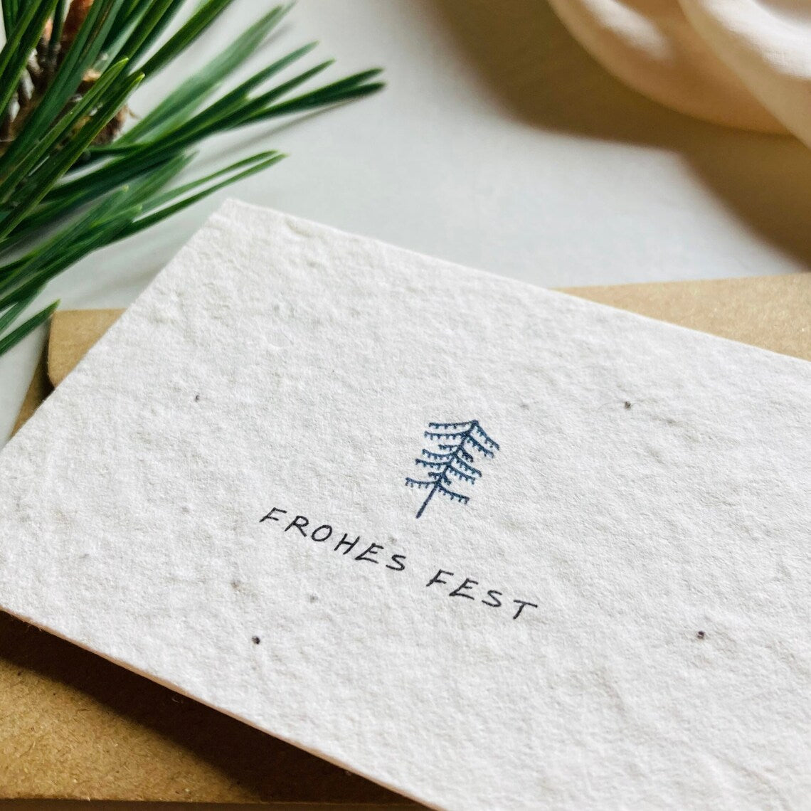 Einpflanzbare Karte aus handgemachtem Saatpapier | Frohes Fest (klein)
